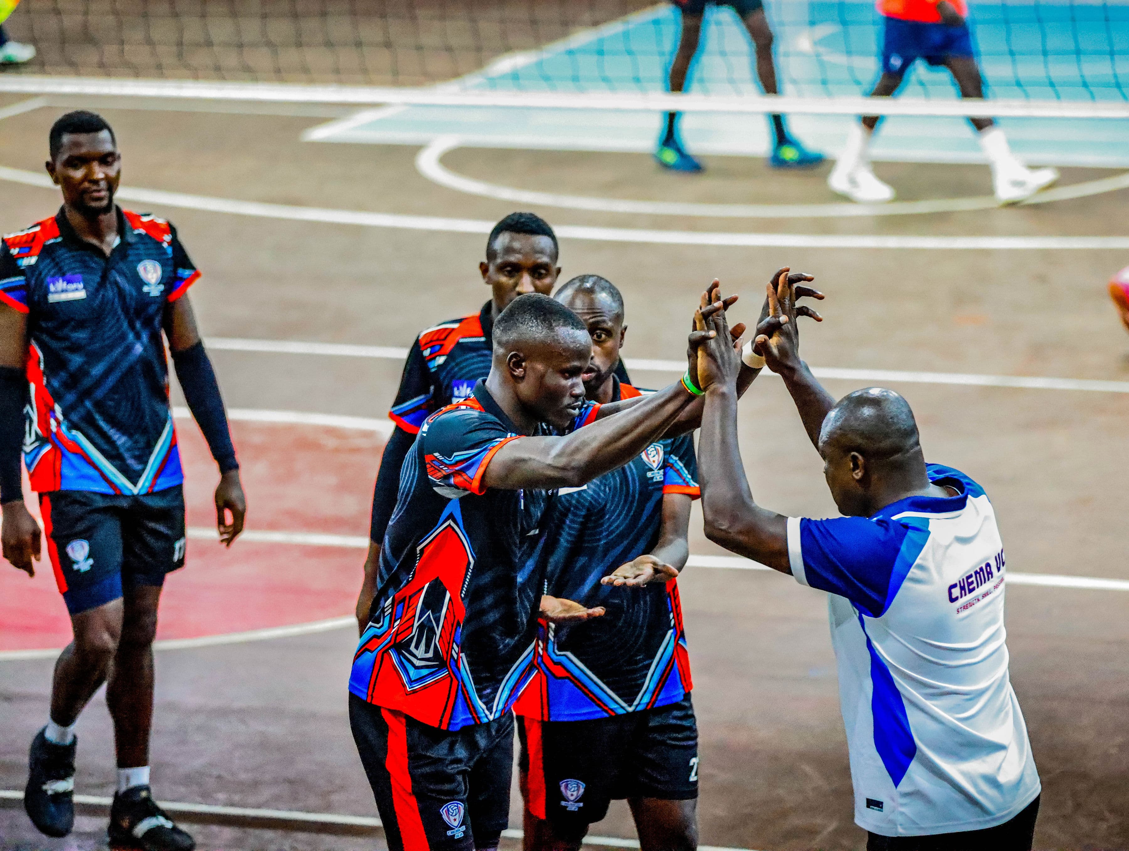 Coach and players exchanging cues during live play