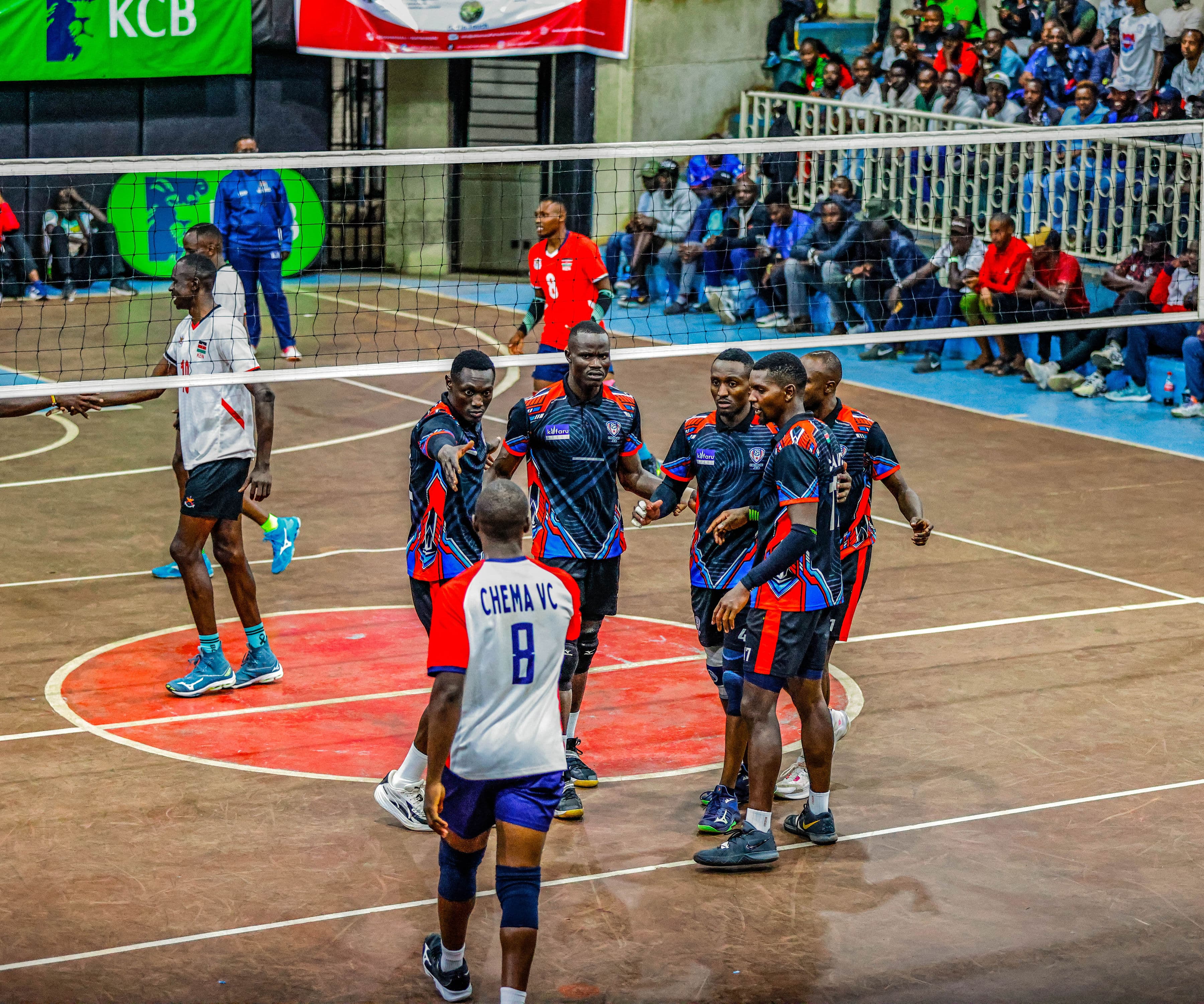 Head coach watching play closely from the sideline