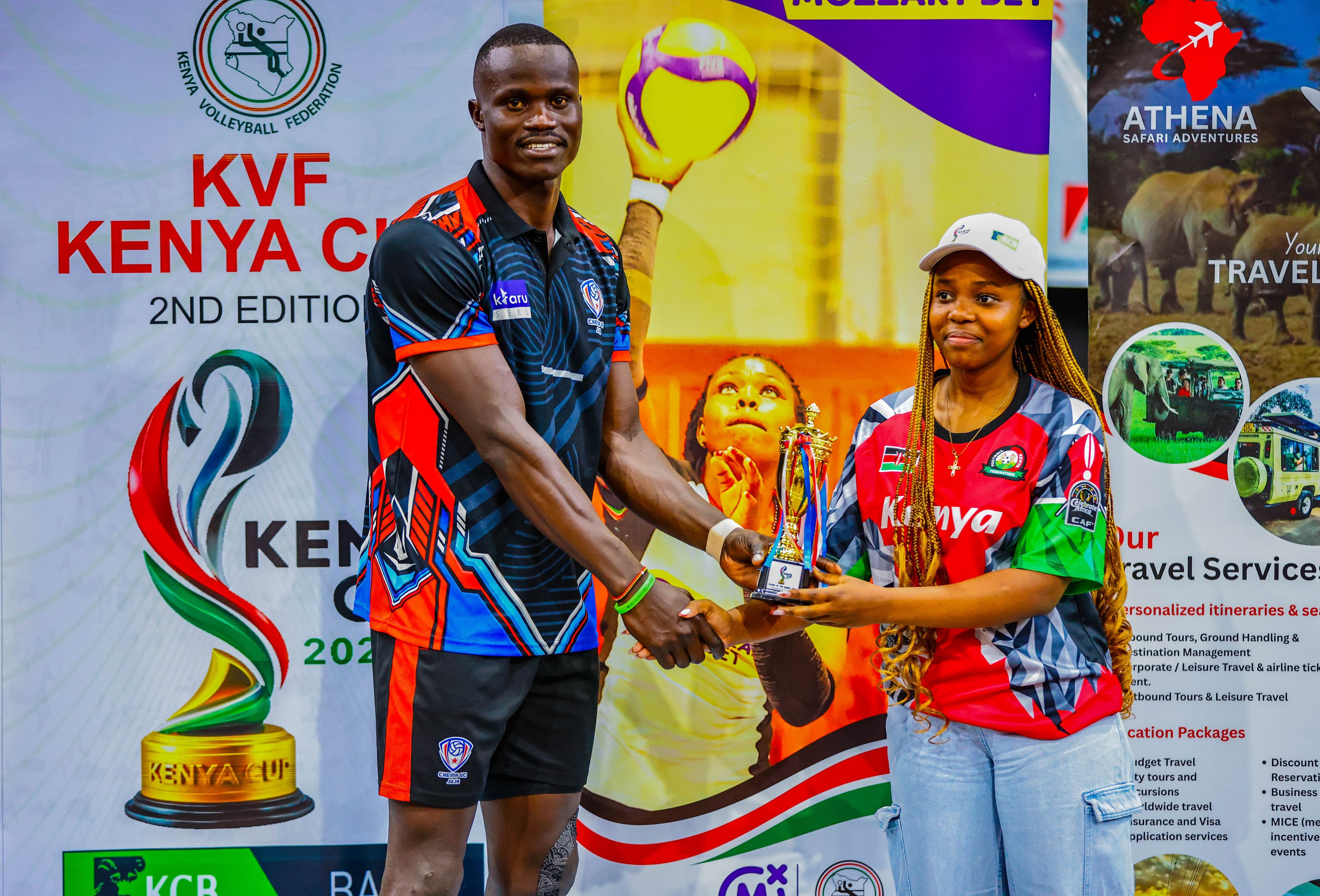 Wide view of match action in a packed indoor arena